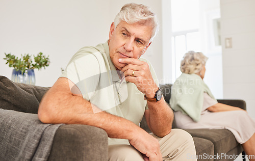 Image of Senior man, fight and thinking of divorce, breakup and stress of sad separation on sofa at home. Frustrated couple on couch in conflict, crisis and problem of drama, bad marriage or emotional anxiety