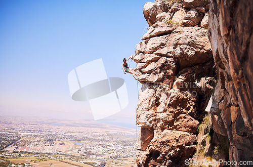 Image of Sports, rock climbing and space with woman on mountain for fitness, adventure and challenge. Fearless, workout and hiking with person on training cliff for travel, freedom and exercise mockup