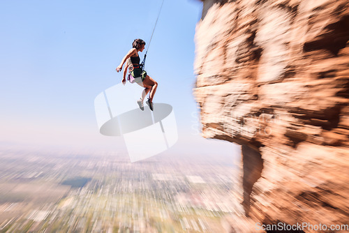 Image of Sports, rock climbing and jump with woman on mountain for fitness, adventure and challenge. Fearless, workout and hiking with person training on cliff for travel, freedom and exercise mockup