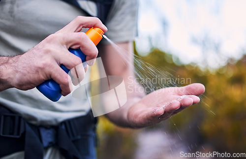 Image of Sunscreen spray, hand and closeup while hiking for security from the sun and health in summer. Exercise, nature and a man with a bottle with cream for skincare and safety from sunshine for fitness