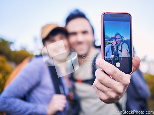 Image of Hiking, nature and couple with selfie on screen for adventure, holiday and journey on mountain. Travel, dating and happy man and woman take picture on phone to explore, trekking and backpacking