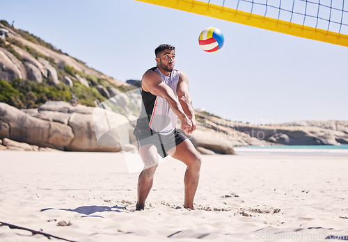 Image of Beach, volleyball and man at net with sports action, fun and summer competition on sea sand. Energy, ocean games and volley challenge with athlete hitting ball for goal at fitness workout in nature.