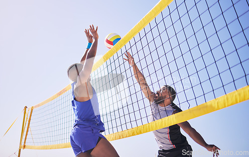 Image of Jump, hit and beach, volleyball and men at net with sports action, fun and summer competition with blue sky. Energy, ocean games and volley challenge with athlete hitting ball for goal in nature.