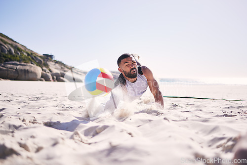 Image of Fitness, beach or man diving for volleyball in competition, match or sports contest playing on sand. Workout, training or athlete jumping to hit ball at sea for summer game, activity motion or action