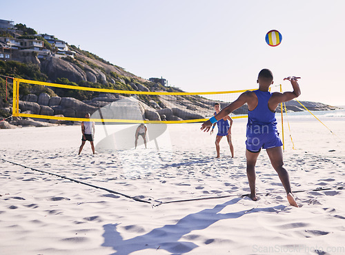 Image of Beach, volleyball and man serve on team with competition at ocean with exercise, sport and fitness. Summer, outdoor and training people play for health, holiday games and workout activity in nature