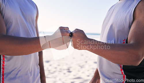 Image of Fist bump, fitness and teamwork with men on the beach for sports motivation together in unity or solidarity. Hands, exercise and support with an athlete team outdoor on the sand for competition