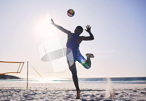 Image of Back, silhouette and a person with a volleyball at the beach for a game or sports competition. Fitness, nature and an athlete playing, training or doing cardio workout at the ocean in summer