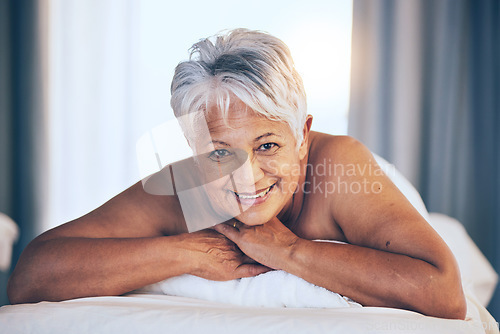 Image of Happy senior woman, portrait and massage in relax for spa treatment, body care and physical therapy at resort. Calm elderly female person smile relaxing on salon bed for zen, stress relief or getaway