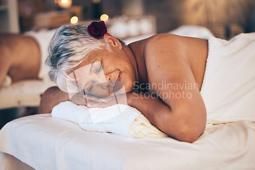 Image of Senior woman, sleeping and relax in massage for spa treatment, body care and physical therapy at resort. Calm elderly female person smile and relaxing on salon bed for zen, stress relief or getaway