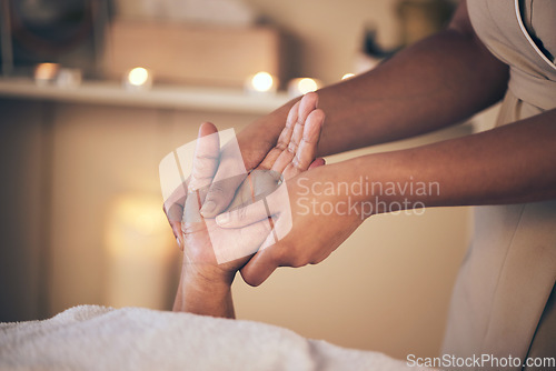 Image of Woman, hands and massage in relax for spa treatment, body care or physical therapy at the resort. Closeup of female person holding hand for stress relief, comfort or zen in healing or reiki at salon