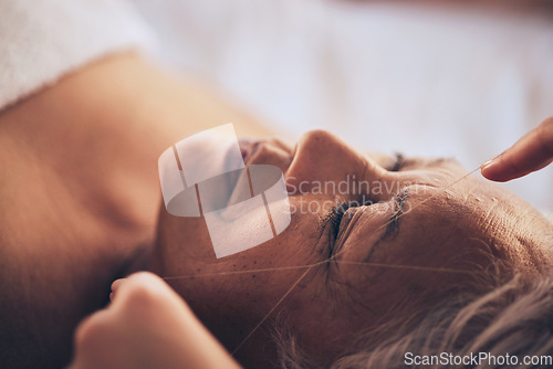 Image of Senior woman, hands and string for grooming, hair removal or threading at beauty salon, spa or hotel resort. Closeup of female person sleeping in relax or zen for facial treatment or physical therapy