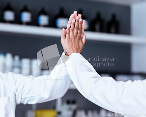 Image of Scientist teamwork, high five and hands in laboratory for motivation, goals or success in pharma company. Team building, congratulations or collaboration in science job for results with vaccine trial