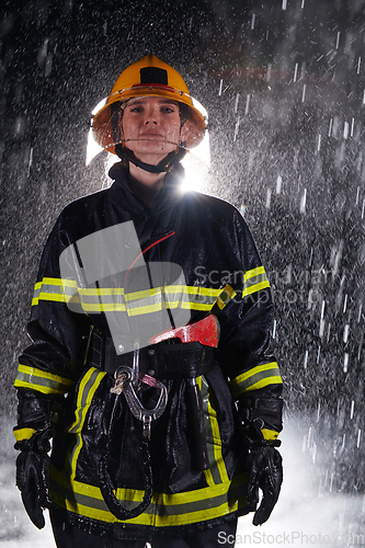 Image of A determined female firefighter in a professional uniform striding through the dangerous, rainy night on a daring rescue mission, showcasing her unwavering bravery and commitment to saving lives.