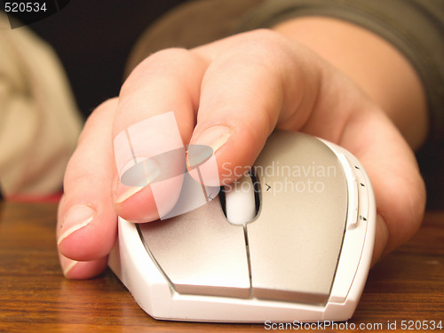 Image of Business concept - Hand using computer mouse on wooden table