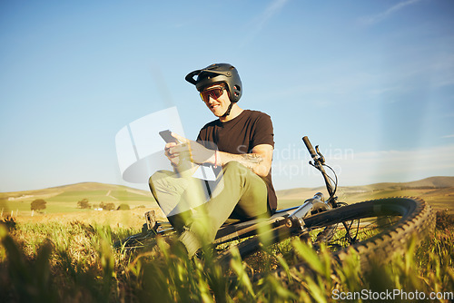 Image of Phone, mountain bike and man outdoor in nature for extreme sports, training or workout. Smartphone, online communication and male person with bicycle for off road cycling, travel or adventure