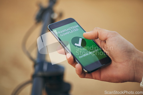 Image of Hands, phone screen and payment notification for transaction, ecommerce or banking outdoor. Fintech, smartphone and person on app for online shopping, internet sales or check mark for digital finance