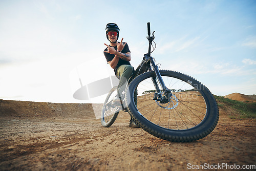 Image of Mountain bike, portrait and with man shaka hand sign on path for extreme sports, happiness and excited mockup. Dirt biking, bicycle and person on trail, track or road space for cycling trick athlete.