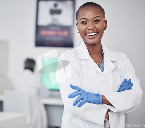 Image of Scientist, black woman and happy in portrait, arms crossed with medical research and science study in laboratory. African female doctor, pathology or biotech, scientific experiment and confidence