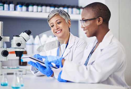 Image of Women, science and teamwork with notes in laboratory for research, medical analysis and biotech discussion. Happy female scientists planning microbiology investigation, feedback and review paperwork