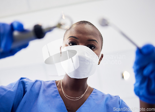 Image of Pov, woman or dentist working with tools to clean teeth in consultation, orthodontics or dentistry clinic or medical surgery. Healthcare, nurse and mask in procedure, test tooth or dental care