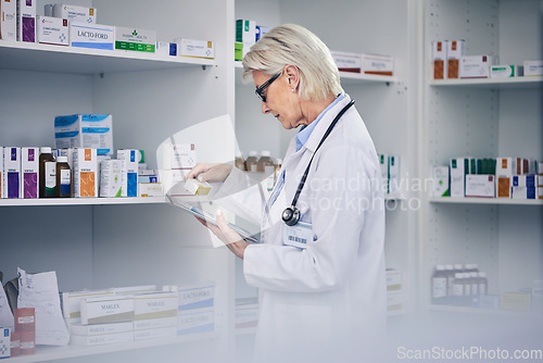 Image of Professional chemist, woman and tablet with medicine for inventory with medical expert for research. Doctor, work and pharmacy with tech to check pills with online information on app for health care.