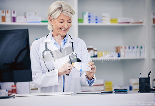 Image of Senior pharmacist, woman and scanning pills, cashier with medicine and pharmacy, digital and stock barcode. Pharmaceutical store, tablet box and female person with health, service and retail commerce