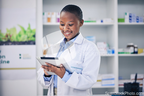 Image of Black woman, happy pharmacist and tablet for healthcare, telehealth and research in pharmacy, drugstore or shop. Medical professional, technology and African doctor with wellness email for medicine.