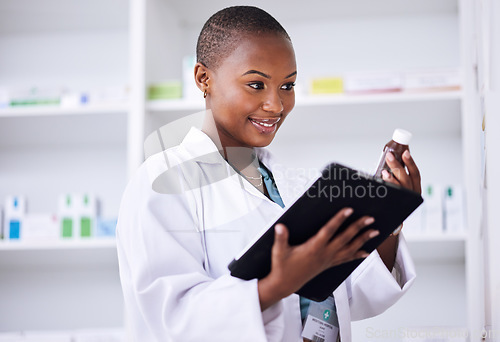 Image of Happy black woman, pharmacist and tablet for inventory inspection or checking stock at the pharmacy. African female person in medical healthcare with pharmaceutical product or checklist on technology