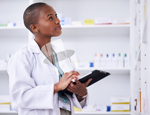 Image of Black woman, pharmacist and tablet for inventory inspection or checking stock at the pharmacy. African female person in medical healthcare looking at shelf for pharmaceutical checklist on technology