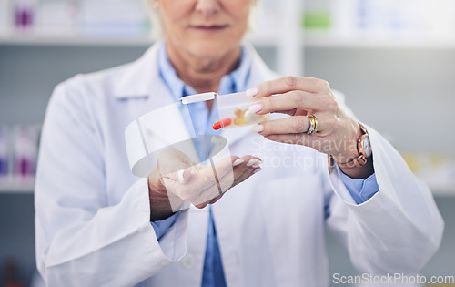 Image of Pharmacist, hands and pills in pharmacy or closeup with medicine support or cure. Prescription, capsules and health care profession at drug store for treatment for correct dose or medical treatment.