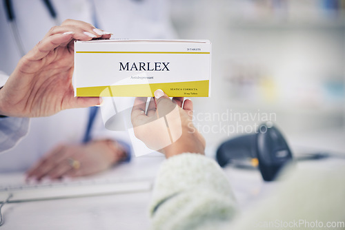 Image of Woman, pharmacist and hands with box of pills for medication, cure or prescription on counter at pharmacy. Closeup of female person or doctor giving tablets or antibiotics for depression at drugstore