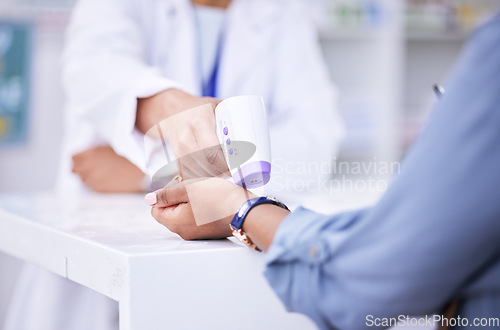 Image of Thermometer, temperature check and hands of people at a pharmacy for healthcare, service or inspection. Medical, clinic and a pharmacist with a customer and gear for a virus test or exam in a store