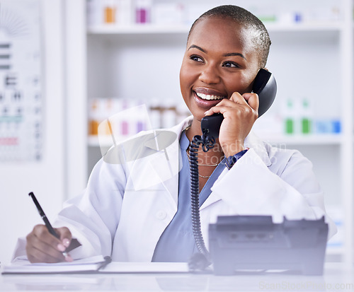 Image of Black woman, pharmacist and phone call for Telehealth, consultation or customer support at the pharmacy. Happy African female person, medical or healthcare professional talking on telephone at clinic