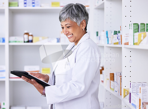 Image of Happy woman, pharmacist and tablet for inventory inspection, stock or Telehealth at the pharmacy. Senior female person smile in medical or healthcare store for pharmaceutical checklist on technology
