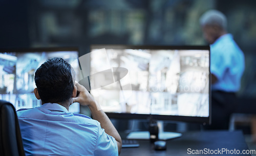 Image of Security guard in control room, man checking cctv screen in surveillance office for building safety. Inspection, technology and video stream to monitor crime, privacy and night protection service.