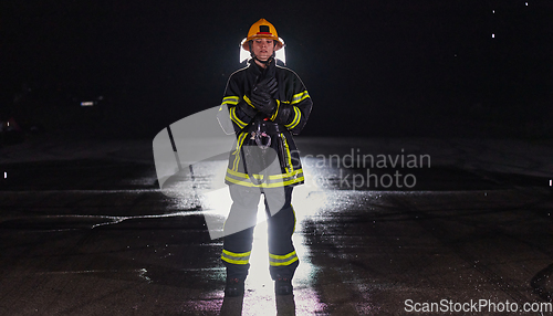 Image of Portrait of a female firefighter standing and walking brave and optimistic