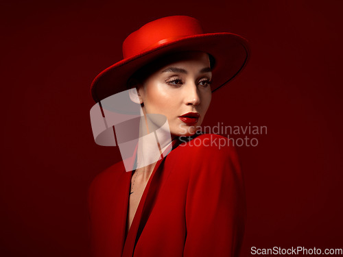 Image of Fashion, thinking and woman in red hat in studio isolated on a background mockup space. Makeup, cosmetics and female model in fedora, serious style and classy clothes with aesthetic, vision and idea