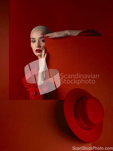 Image of Portrait, fashion and mock up with a woman on a red background in studio for marketing, advertising or branding. Luxury, aesthetic beauty or style with a trendy young model standing with empty space