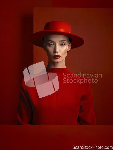 Image of Portrait, fashion and space with a woman in red on a studio background for marketing, advertising or branding. Reverse, style or a trendy young female person standing with empty or blank mockup