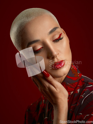 Image of Woman, beauty and red makeup with fashion and art deco, aesthetic and shine isolated on studio background. Female model, skin glow with bold cosmetics, young female model with glamour and creative