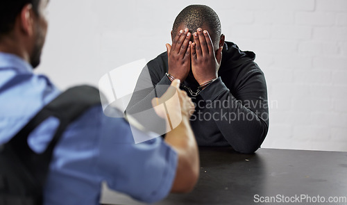 Image of Policeman, criminal and handcuffs for interrogation, question or arrest in fraud, scam or crime. Law enforcement officer pointing to prisoner, gangster or thief for robbery justice in prison or jail