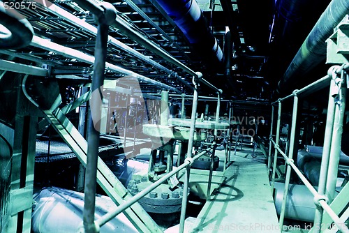 Image of Equipment, cables and piping as found inside of a modern industr