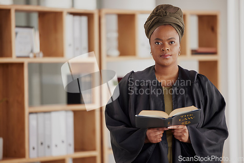 Image of Portrait, black woman or lawyer with book, constitution research or education in law firm office. Justice, advocate or proud African attorney with knowledge, empowerment or info for legal agency