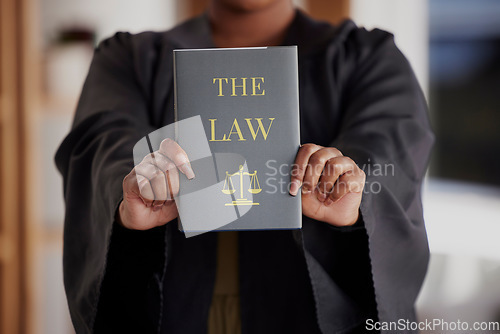 Image of Hands, lawyer or advocate with book, constitution research or education for learning the justice system. Woman, judge or closeup of attorney studying knowledge, guide or information for legal agency