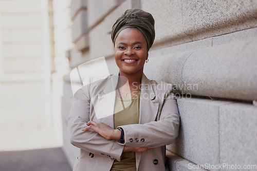 Image of Lawyer, happy and black woman is confident in city with vision or empowerment in career. Smile, portrait and african female attorney with crossed arms at job as advocate outside courtroom or agency.