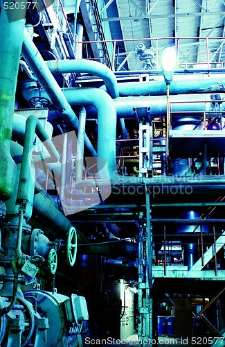 Image of Equipment, cables and piping as found inside of a modern industr