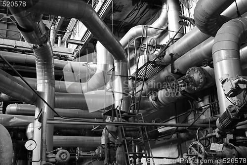 Image of Equipment, cables and piping as found inside of a modern industr