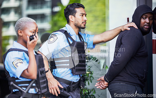 Image of Police, arrest and criminal outdoor, justice and legal with power struggle, crime and walkie talkie. Officer, suspect in a street or professional law enforcement with a man, downtown, jail or service