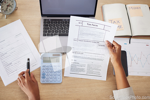 Image of Taxes form, documents and business person for financial application, audit and time management on computer. Laptop, calculator and accountant or people hands for finance paperwork and accounting