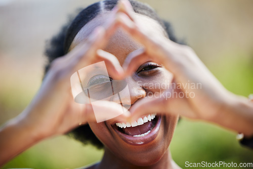 Image of Happy black woman, portrait and face with heart hands for love, care or healthy wellness in nature. African female person smile with like emoji, symbol or icon and hand gesture for romance outdoors